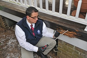 A Bug Doctor technician inspects one account’s termite damage. Photo by Fred Miller, fmfotofm@aol.com