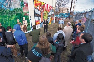 The winning mural can be seen behind Malden Mayor Gary Christenson and Yankee Pest Control Owner Galvin Murphy (pictured from left to right). Photo: Paul Hammersley