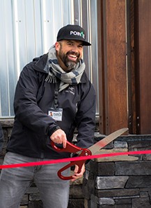 Founder and President Jacob Borg cuts the ribbon on the new center.