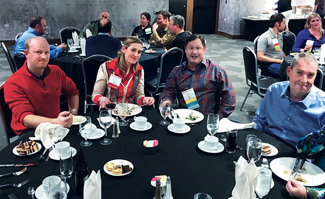 The author (third from left) networks at the luncheon. 