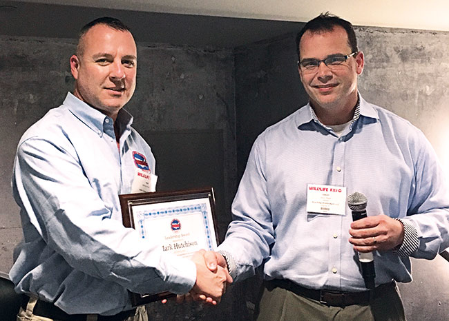 NWCOA Western Director Mark Hutchison, Critter Control of Reno, Nev., left, receives a Certificate of Appreciation from President Jason Reger, CWCP, Blue Ridge Wildlife Management, Roanoke, Va.