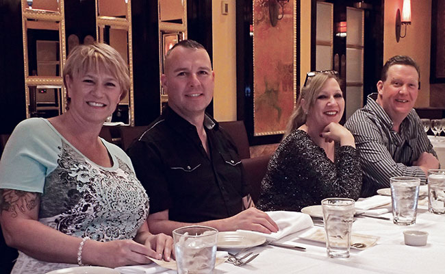 The Hutchisons and Holts enjoy lunch together. 