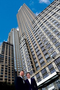 Aust and his son Dan stand in front of another big-ticket account, Trump Place. Photo: Fred Miller, fmfotofm@aol.com