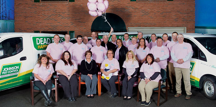 Johnson Pest Control’s Donna Coker (front row center, holding duck) inspired a cancer awareness campaign that’s showcased on the company’s trucks. Photos: Johnson Pest Control