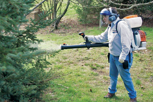 Always wear protective gear, like Laura Dykes of Cooper Pest Solutions. Photo: Cooper Pest Solutions