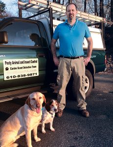 From left are Holly, Faith and their handler, Glenn Holschwander.  Photo: Pesty Animal & Insect Control