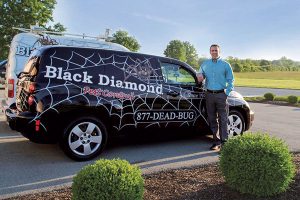 Black Diamond’s Keith Duncan Jr. and his custom-wrapped vehicles. Photo: black diamond Pest controL