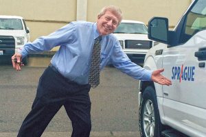 Treleven jokes around in the Sprague home office parking lot.  Photo: Larry Treleven