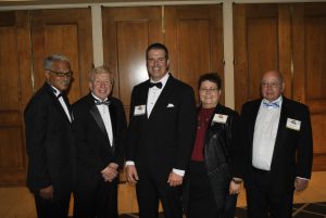 The PMP Hall of Fame induction ceremony for the Class of 2016 included, from left to right, Dr. Vernard Lewis; Larry Treleven; Blair and Brenna Toblan, who accepted the honor on behalf of their father, the late Vern Toblan; and Dick Sameth.