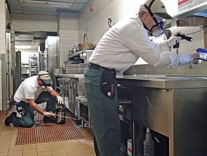 Restaurant jobs often require a PMP to get down and dirty on their knees. As with most jobs, gloves and a flashlight are essential. Photo: Terminix Service Co.