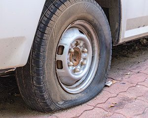 is-477943536-flat-tire