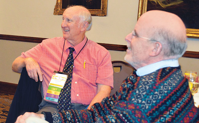 Purdue’s Dr. Gary Bennett (left) and Boilermaker-turned-consultant Dr. Bobby Corrigan, both PMP Hall of Famers, shared a laugh at the Pi Chi Omega meeting.