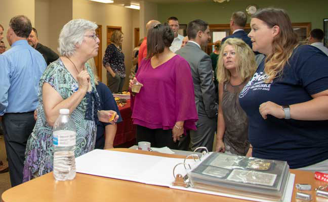 Memory books at Reliable Pest Solutions anniversary celebration