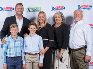 Shay Runion, center, is flanked by her husband, sons and parents. PHOTO: ARROW EXTERMINATORS