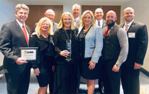 Pictured from left to right:Tim Pollard, Melody Thomas, Joe Thomas, Emily Thomas Kendrick, Hugh Kendrick, Shay Runion, Charlie Jones, Xavier Cugnon and Mike Malone. PHOTO: ARROW EXTERMINATORS