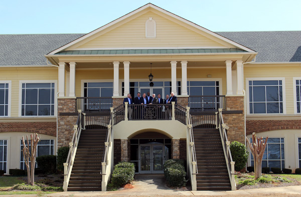 Active’s leadership team stands on the balcony of the new headquarters. PHOTO: ACTIVE PEST CONTROL