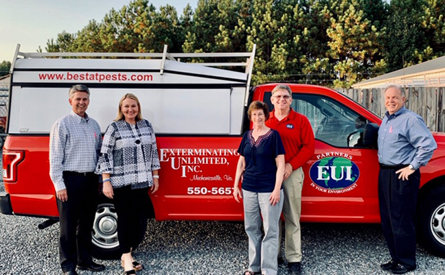 Tim Pollard, Emily Thomas Kendrick and Kevin Burns of Arrow Exterminators stand with Beth and Craig Duncan (center) of Exterminating Unlimited. (PHOTO: ARROW EXTERMINATORS)