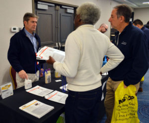 Brian Cooney with MGK discusses CrossFire and . Decimari with New York Pest Expo attendees. PHOTO: MARTY WHITFORD