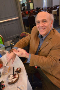 Lou Sorkin, BCE, shows off a cockroach among many other pests he brought to the 2019 New York Pest Expo for attendees to check out. PHOTO: MARTY WHITFORD