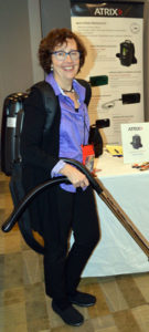 Mary-Shea Murphy, the Business Development Manager with Atrix International, demonstrates one of the company's ultrafine filtration vacuums. PHOTO: MARTY WHITFORD