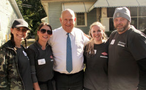 Gary Rollins (center), vice chairman and CEO of Rollins Inc., joins Rollins volunteers for a picture during the volunteer event. PHOTO: ROLLINS INC.