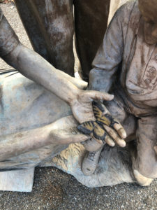 The only spot of color on the bronze sculpture is a butterfly, perhaps symbolic of the growth in breadth and depth of entomology because of these three figures. PHOTO: HEATHER GOOCH