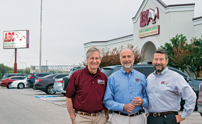 From left, Bobby, Raleigh and Dennis Jenkins stand in front of the Austin, Texas, headquarters of Bobby’s company. Photo: Anna Munoz