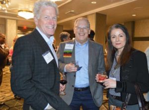 Alfie Treleven of Sprague Pest Solutions, Russ Ives of Rose Pest Solutions and Dr. Cisse Spragins of Rockwell Labs (pictured from left to right) catch up at the Legislative Day Welcome Reception. PHOTO: PMP STAFF