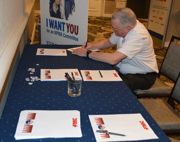 AP&G’s Vice President of technical products and services Dr. Stan Cope composes a letter to the troops as part of Operation Gratitude. PHOTO: PMP STAFF