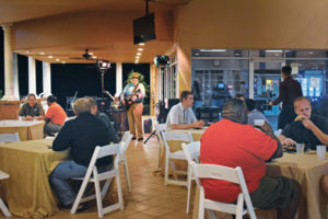 Local entertainer Vic Hill provided delightful background music for the Thursday night barbecue with his versatile singing voice and acoustic guitar. PHOTO: PMP STAFF