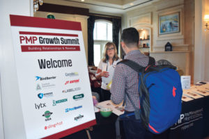 PMP Marketing and Event Director Michelle Mitchell greets a participant. PHOTO: PMP STAFF