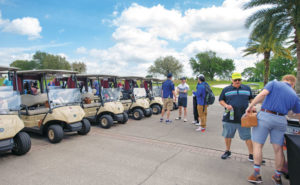 As they await the shotgun start, golfers grab lunch. PHOTO: LOU FERRARO, PARK SOUTH PHOTOGRAPHY