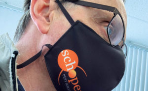 The author models his company-branded mask. PHOTO: PETE SCHOPEN