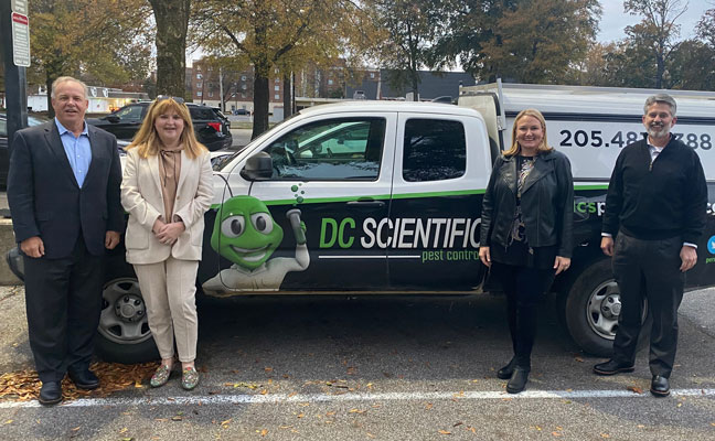 DC Scientific's Ann Majcher, second from left, is flanked by, from left, Arrow's Kevin Burns, Emily Thomas Kendrick and Tim Pollard. PHOTO: ARROW EXTERMINATORS