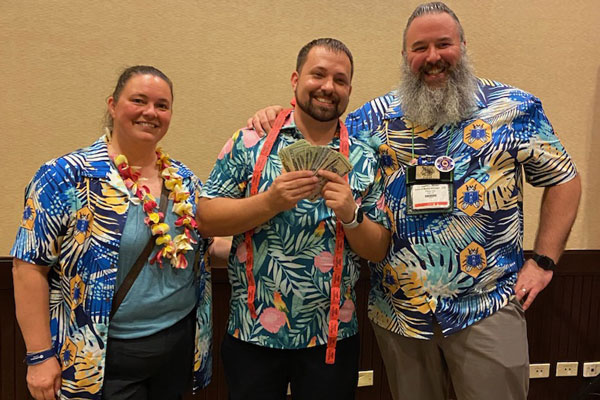 During Pi Chi Omega's "Raise the Bar" event late Thursday, the 50/50 raffle netted Liphatech's Nick Fugate $1,155. Fugate, pictured center with newly installed Pi Chi Omega President Desiree Straubinger of BASF and James Miller of Trece Inc., donated the winnings back — giving the industry fraternity a total of $2,310 to put toward its scholarship and educational goals. PHOTO: PI CHI OMEGA