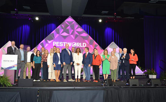 The National Pest Management Association’s officers is made up of 26 voting members. They gathered onstage at Wednesday’s Opening General Session. PHOTO: PMP STAFF