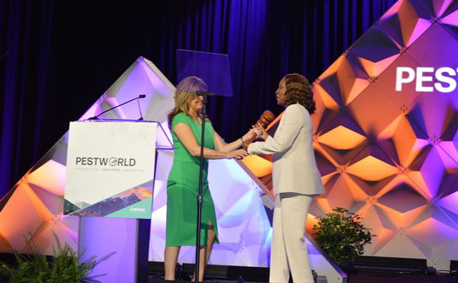 National Pest Management Association Past President Marillian Missiti ceremoniously passed the gavel to President Faye Golden, formally kicking off 2024-2025. PHOTO: PMP STAFF