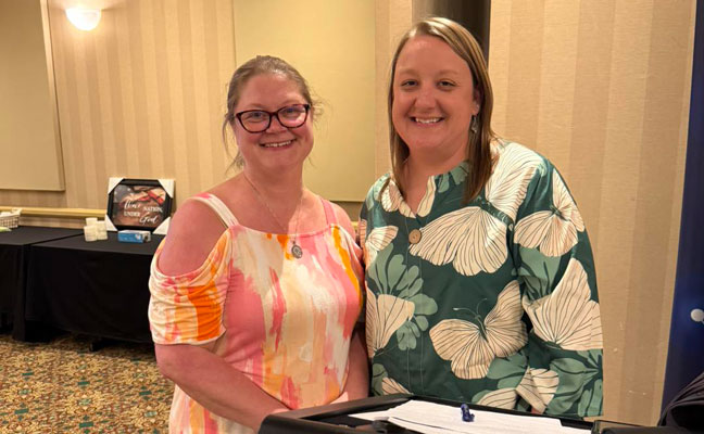 Executive Director Holly Fletcher-Timmons takes a quick break with Immediate Past President Carrie Campbell.