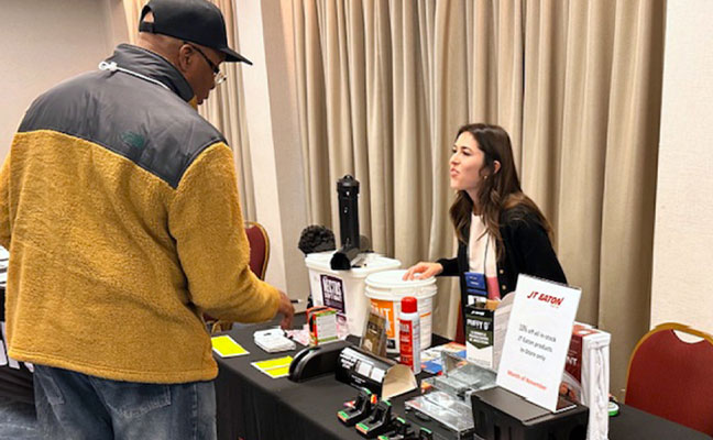 Isabelle Lucero, from JT Eaton engaging with an attendee on the trade floor. IMAGE: PMP STAFF