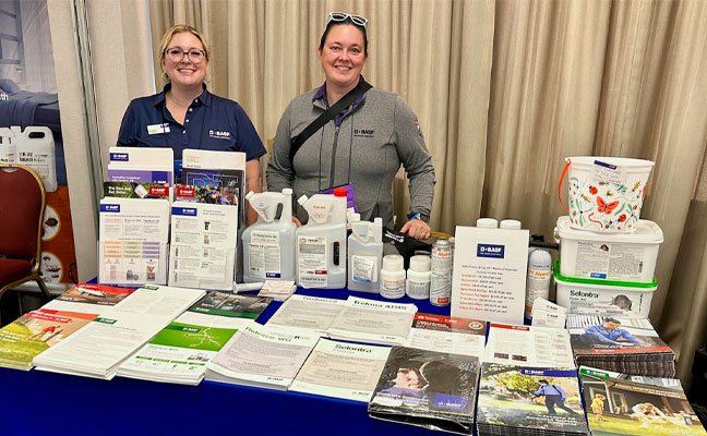 Kelley Altland(left) and Desiree Straubinger(right) at the BASF booth on the trade floor. IMAGE: PMP STAFF