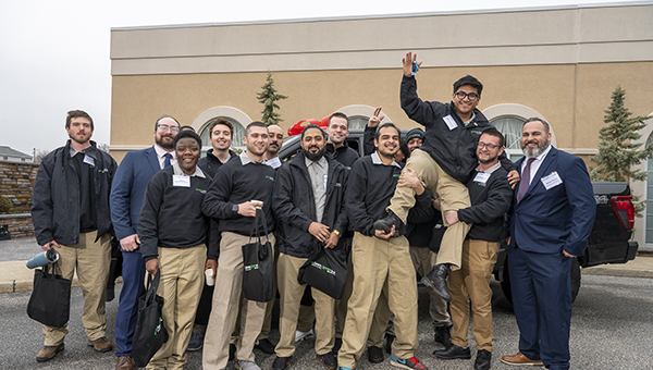 Green Lawn celebrates Jhoan Navarro after winning the truck giveaway. IMAGE: GREEN. LAWN