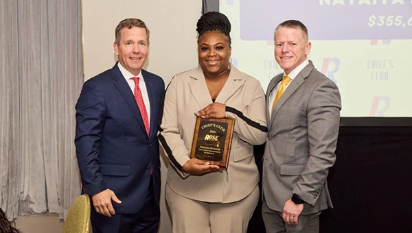 From Left: Bob Dold, owner and CEO of Rose Pest Solutions;  Natalya Brewton, Customer Care rep and award recipient; Curtis Rand, Rose Pest Solutions president.