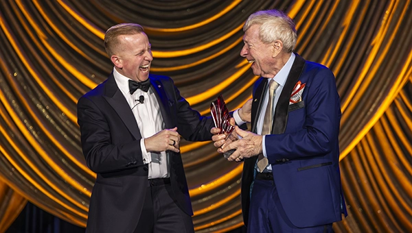 Larry Treleven (right) accepts the Lifetime Achievement Award from his son Ross Treleven at the company’s 100th anniversary celebration. IMAGE: SPRAGUE PEST SOLUTIONS
