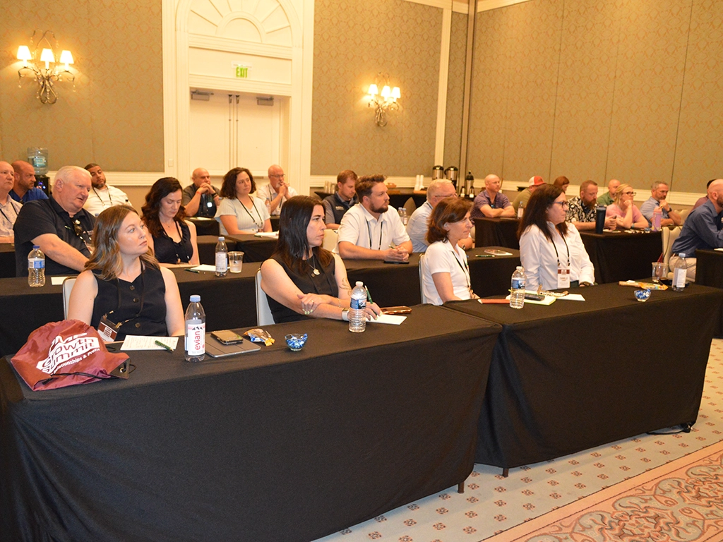 Attendees listen to partner presentations to kick off the 2026 Summit.
