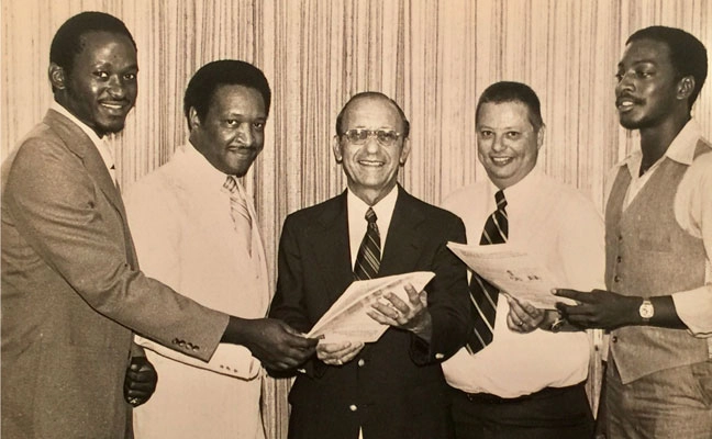 SCHOLARSHIP WINNERS: The first FAMU and Black students to receive the Florida Pest Control Association Scholarship (circa 1978) are, from left, student John Dukes III (currently founder and owner of Dr. Buggs Exterminators, Gainesville, Fla.; then-FAMU President Dr. Walter Washington; Reuben Capelouto, founder of Tallahassee, Fla.-based Capelouto Pest Control; Dr. Bill Peters, who began the FAMU entomology program and for whom the Field Day event is named; and student John Houston. (PHOTO: JOHN DUKES III)