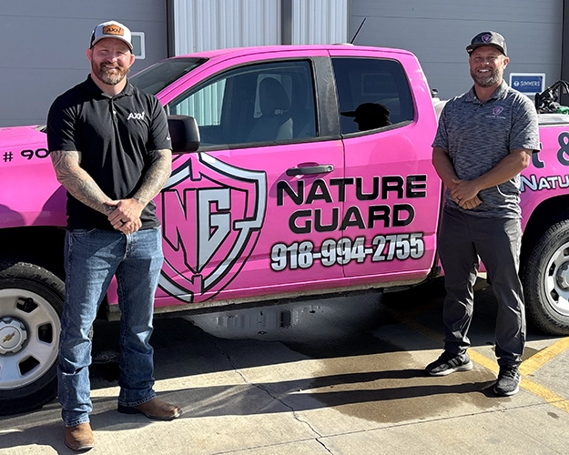 Brent Agee and Chantry Palmer in front of truck