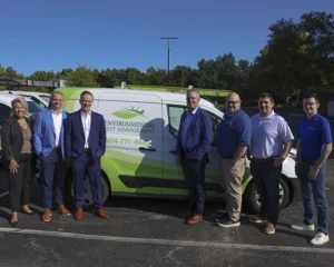 EPM and Anticimex leaders in front of an EPM vehicle