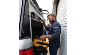 Photo of tech using Adrian Roll-Up door