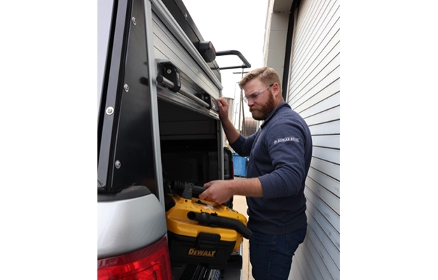 Photo of tech using Adrian Roll-Up door