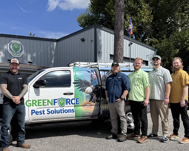 AXN/Greenforce photo in front of Greenforce truck